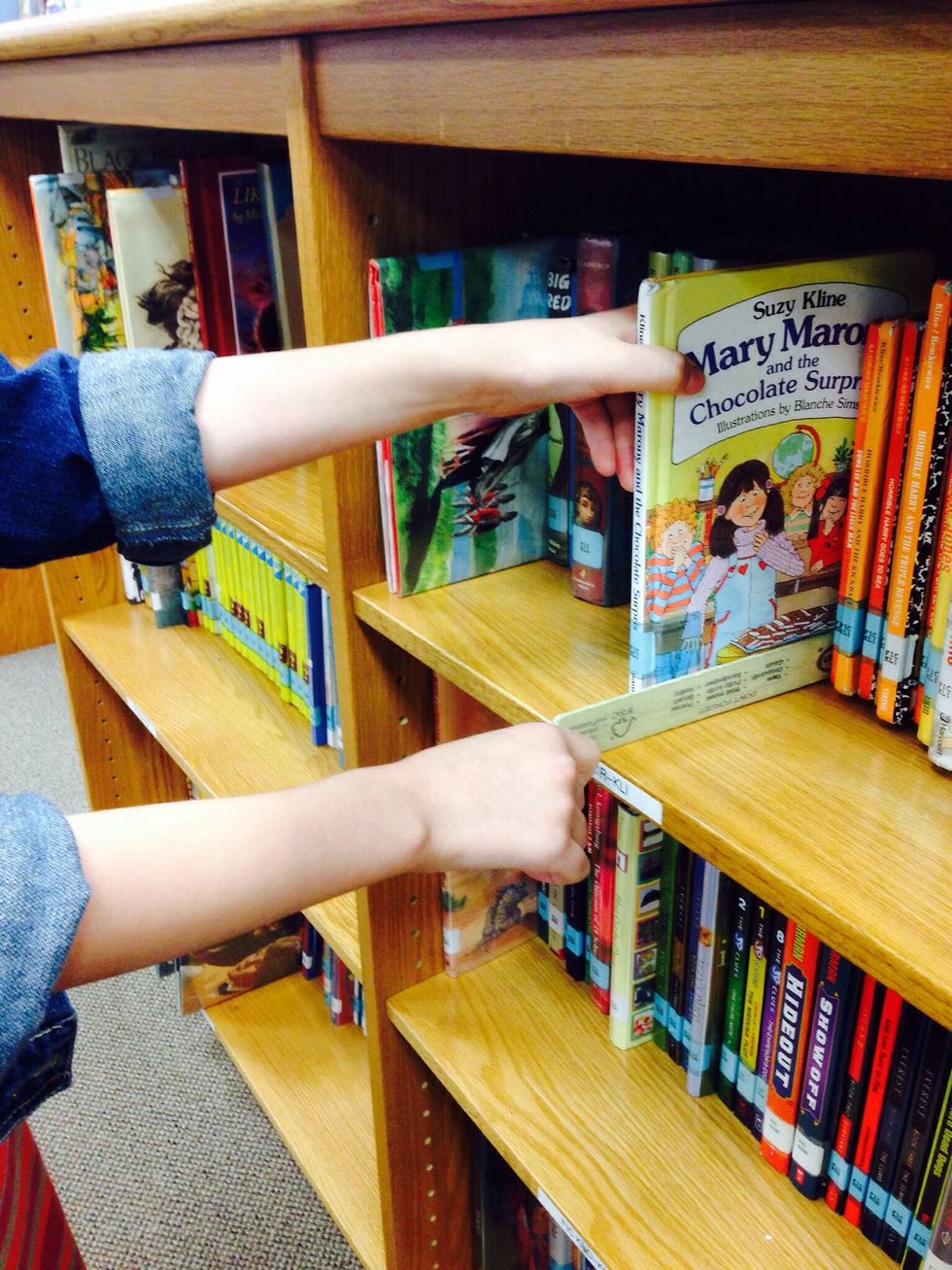 7. If you are browsing you should look at the spines for the titles of books. When you find something interesting put your shelf marker next to that book and then you may take the book off the shelf.