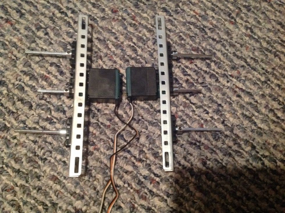 7.Next, take six Metal Collars and slide over the outside of the Square Rods. Fasten once Collar is against body; refer to the picture for help.
