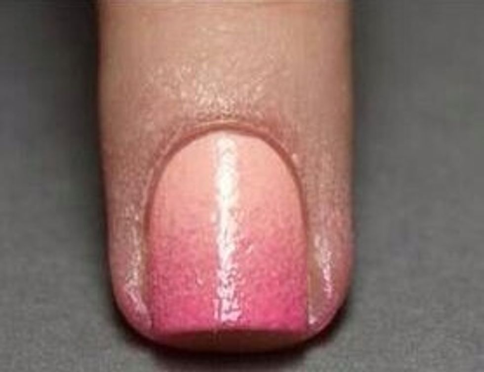7. Once dry, take the nail polish remover and pour some onto a Q-tip. Then, move the wet Q-tip around the edge of the nail to take off all excess polish.
