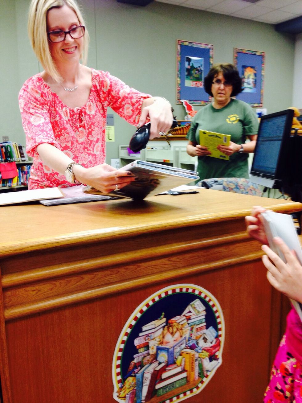 7. Once you have found some good fit books, go to the check out desk and ask the librarian to scan your books. Now the books are checked out to you.