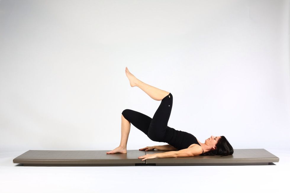 7. SHOULDER BRIDGE LIFT AND LOWER- Flex knee bringing leg to table top.