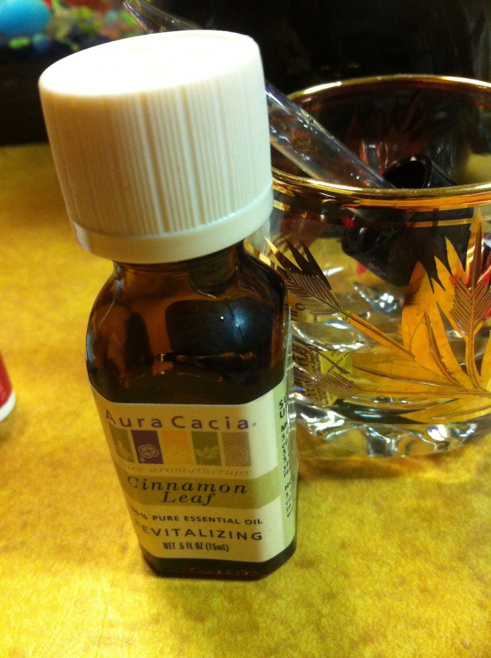 8 drops of cinnamon leaf essential oil into a mixing container with enough room for mashing.
