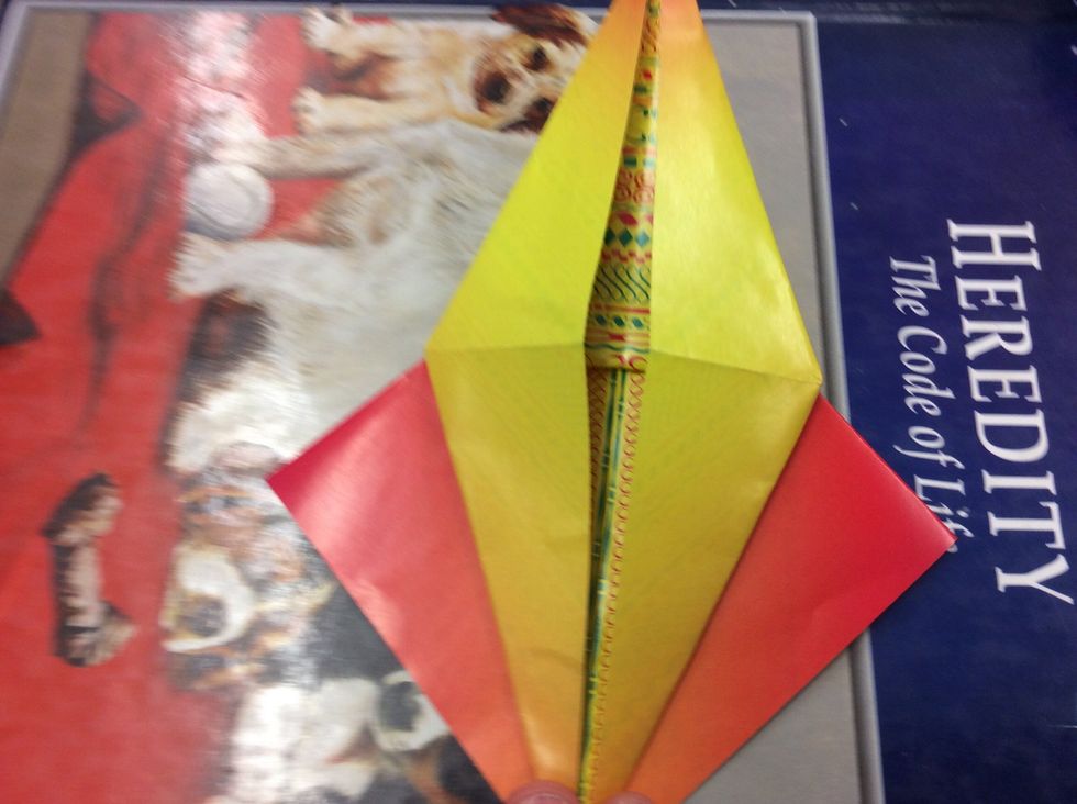 8. Press it down so it looks like a long diamond.