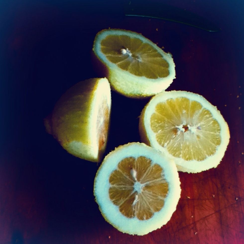 9. For the syrup. (the syrup you pour over the loaf) Cut the two lemons you grated and take the juice and put it in a pot with the 1/4 cup castor sugar.