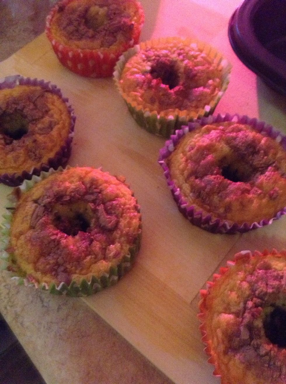 9.) Once mostly cooled down, cut a hole in the middle of each cupcake. It is important to make sure the cupcake is cooled enough, or else it will break during the cutting