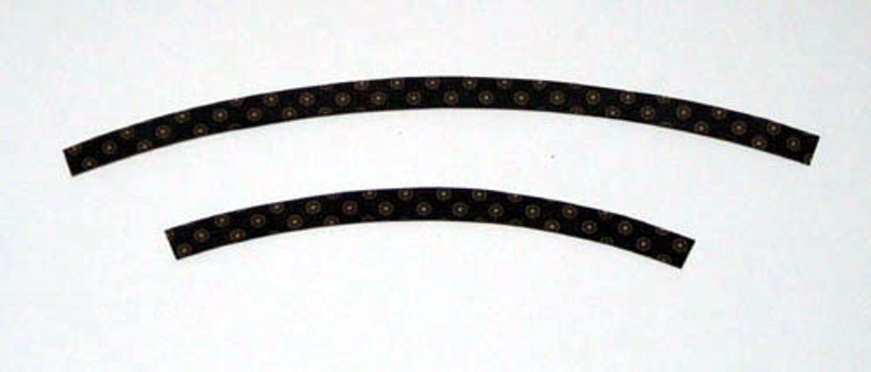 9.\tTrace both 1/2\u201d accent strips onto the back of your accent paper.  Cut out.
