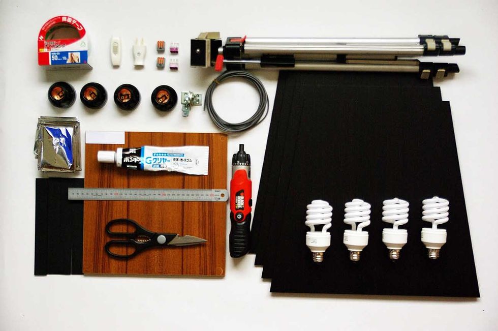 a base board a corrugated plastic a velcro tape an aluminum foil a socket a double sided tape a switcha outleta joining terminala distribution cablea tripodgluea rulerscissors