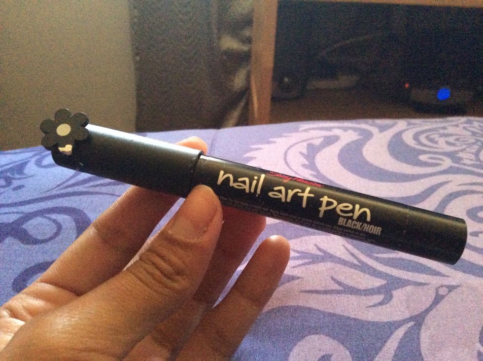 A black nail art pen