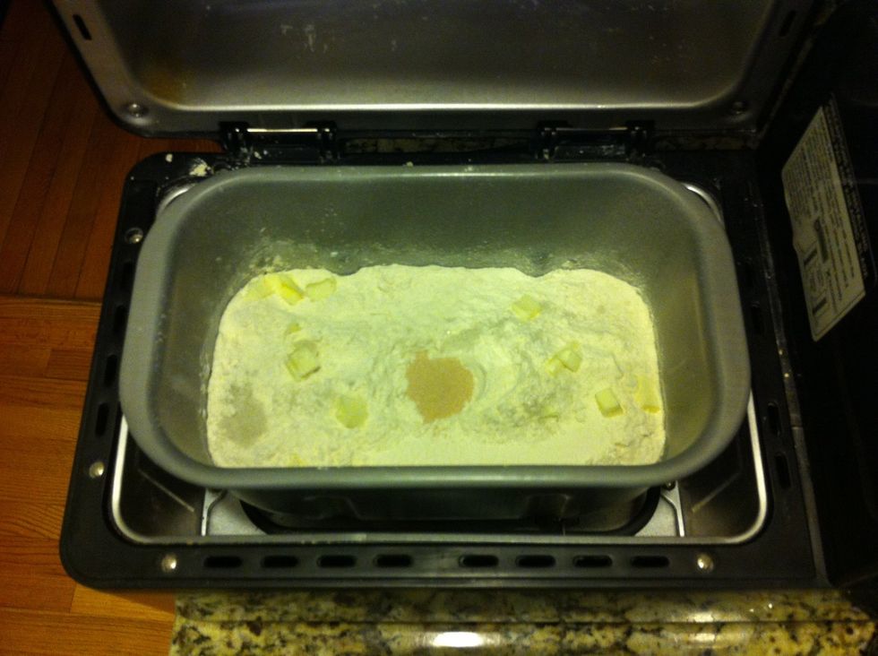 A bread machine does the kneading and rising, but not the baking. Program: 18min knead, 45 min rise 1, knead down, 85 min rise 2.