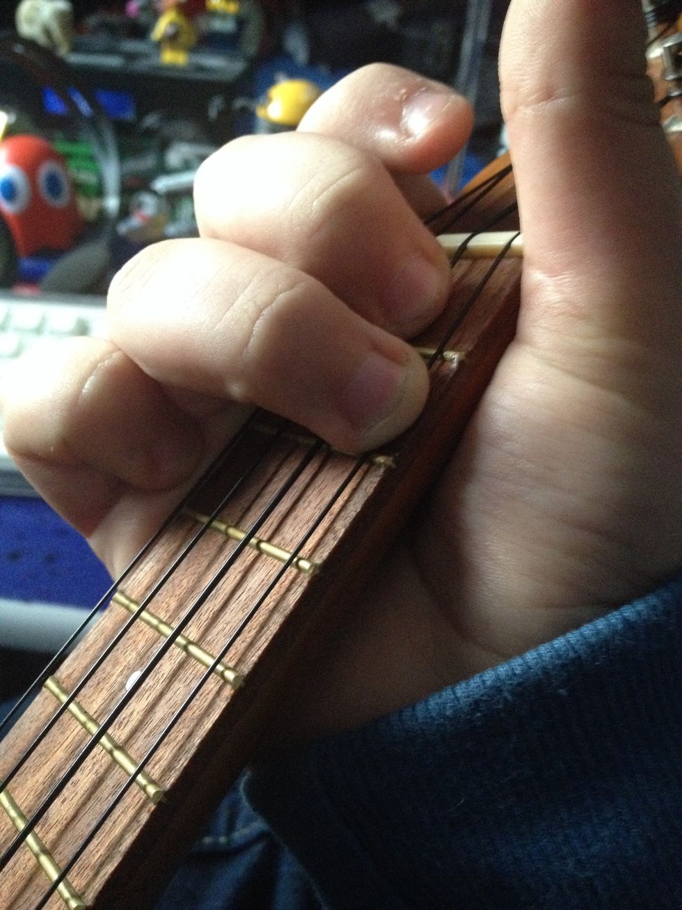 A chord. 3rd string, 1st fret. 4th string, 2nd fret.