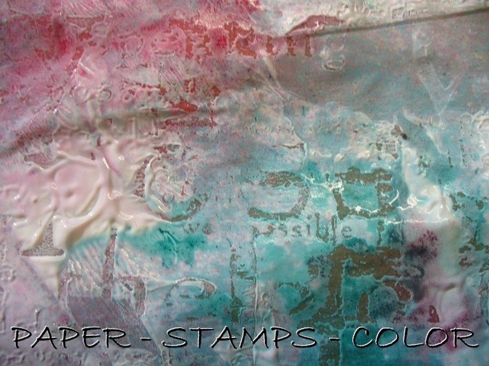 A close-up of the background after stamping on it. NOTE: to achieve crisp stamping, clean the stamp inbetween if it gets clogged with gesso.