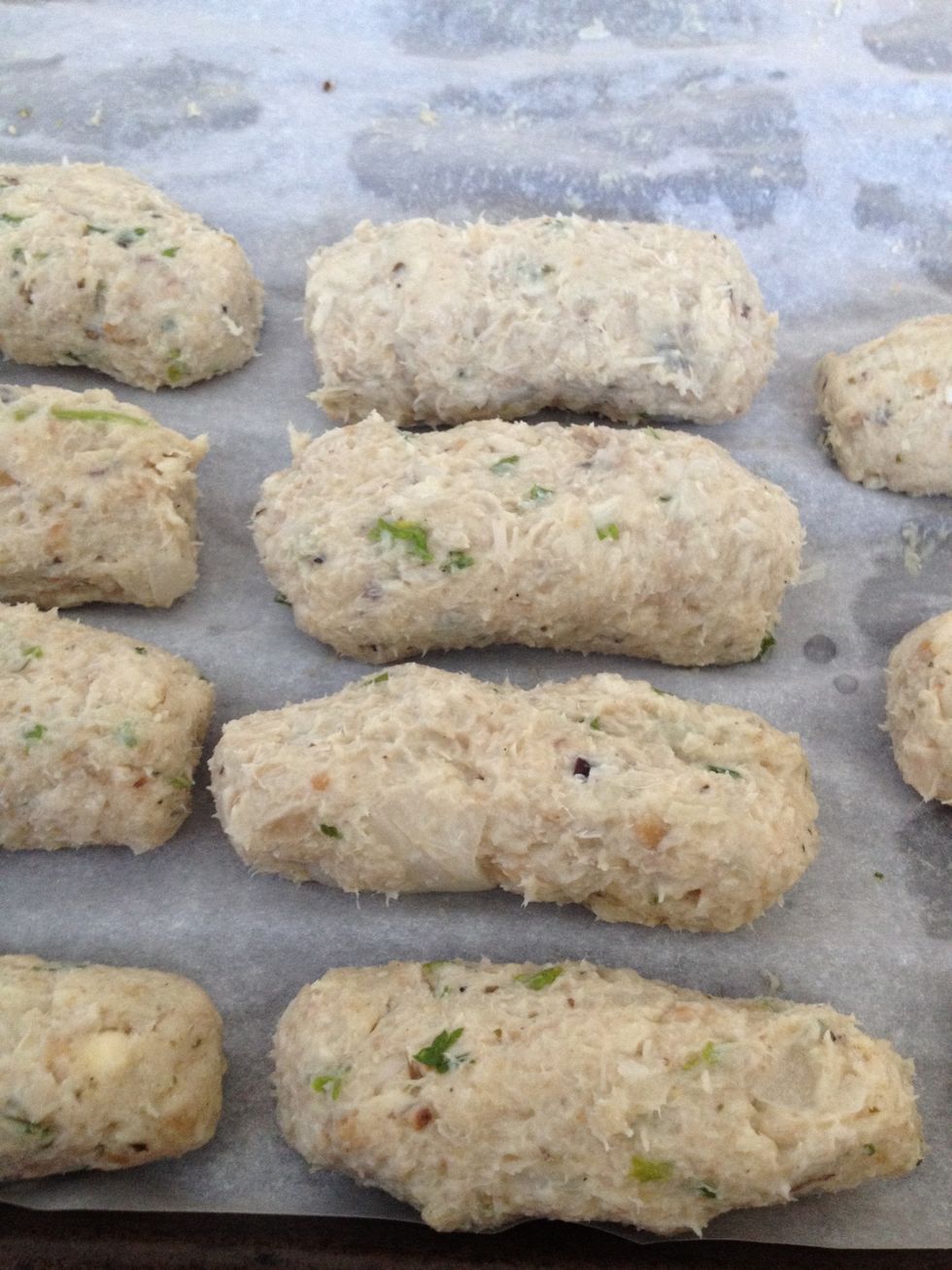 A close-up shot. You can actually put these back in the refrigerator to firm up again. Or you can go to the next step which is to coat with egg and breadcrumbs.