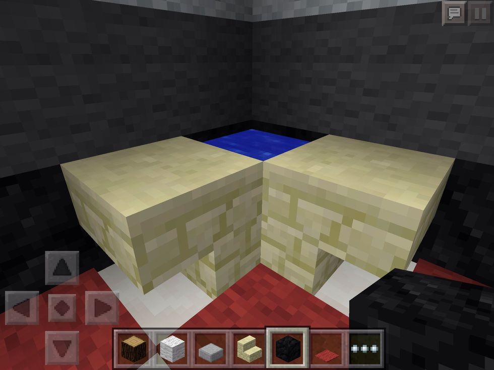 A corner sink, to avoid taking up too much room! Some fancy carpet tiles also brighten the place up!