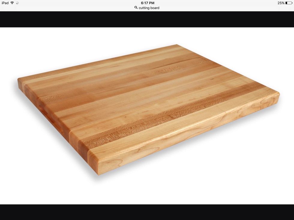 A cutting board is used to cut food on. I can use this to cut food on.