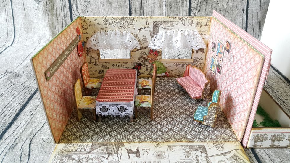 A dining table, 4 dining chairs and 2 sofas.