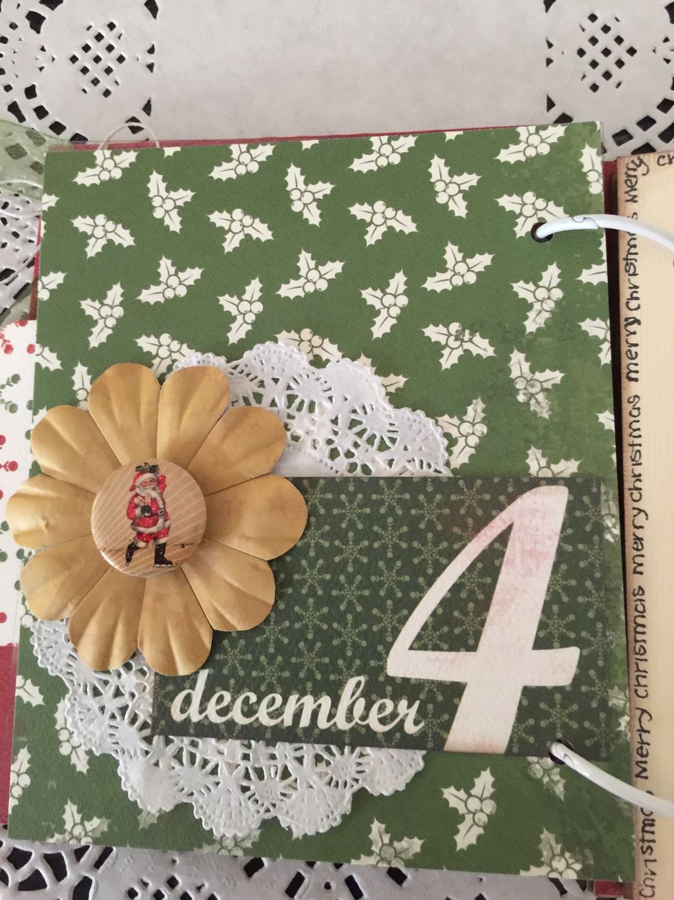 A doily and badge and a flower with a die cut. Just super simple and ready for the photos and some journaling when the time comes!