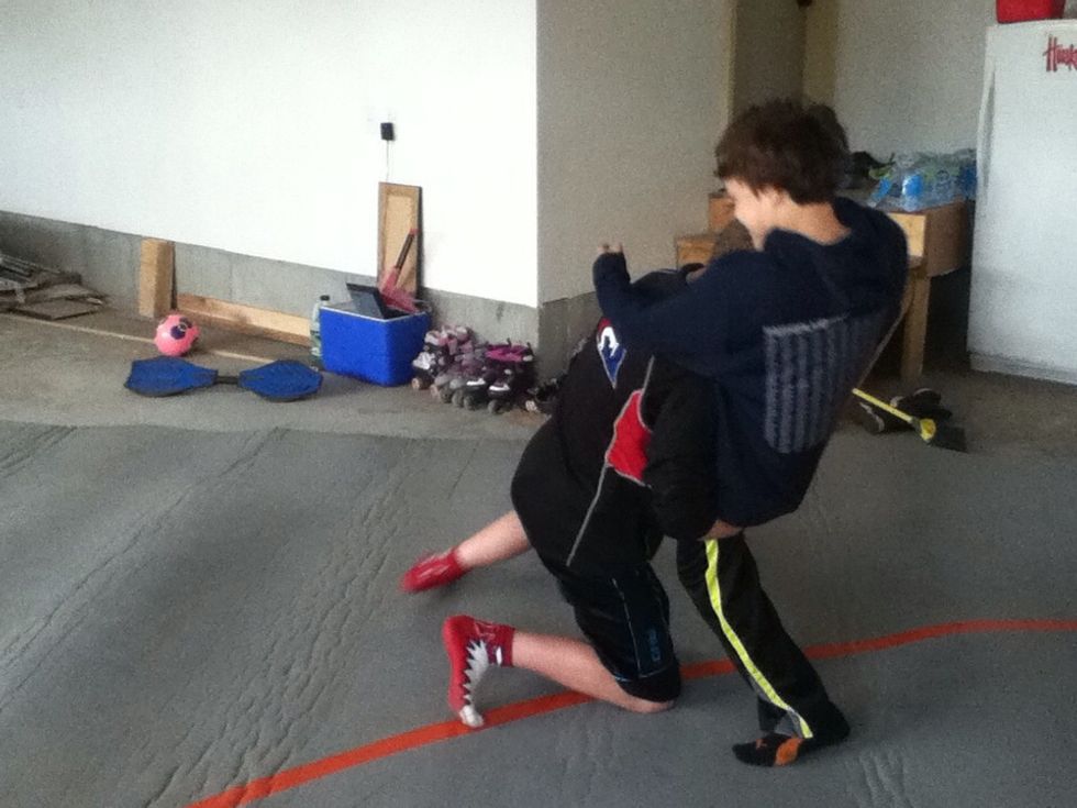 A double leg is where you shoot in on him and grab both of his legs