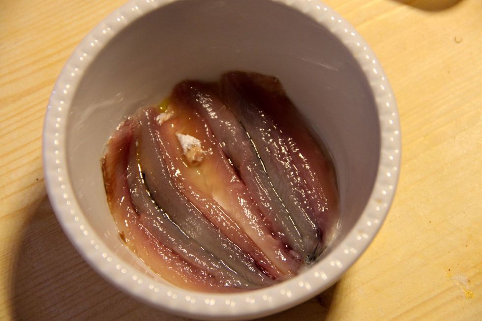 A first layer of anchovies