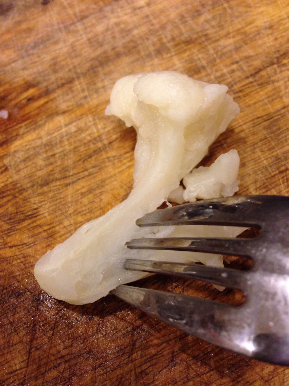 A fork should easily pierce the floret pieces when done. Cauliflower should be soft and creamy.