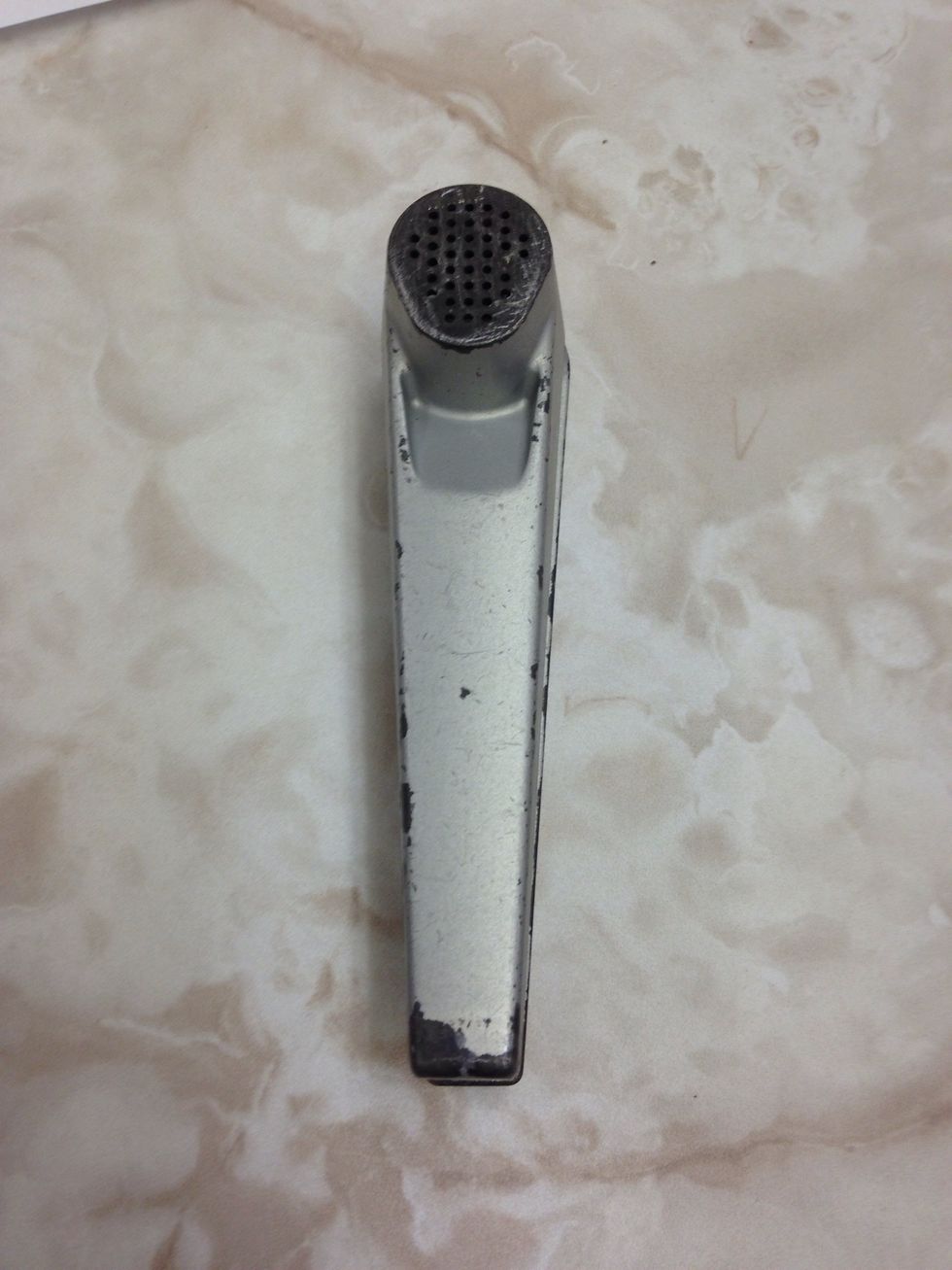A garlic press is used to smosh garlic. I can use a garlic press to make my garlic in smaller pieces.