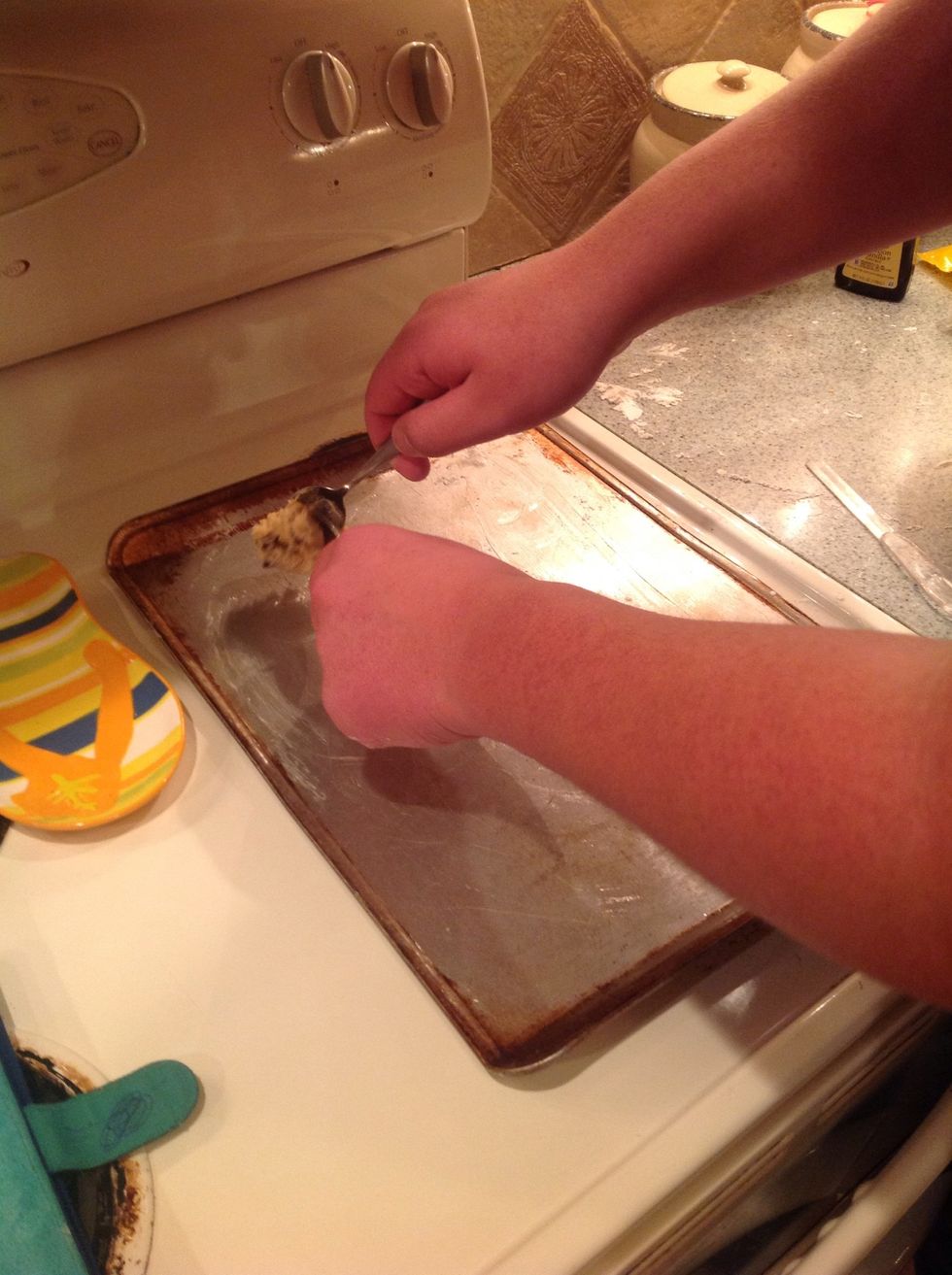 A good tip is too use two spoons and get a spoon full of cookie dough and then you put it on your pan.