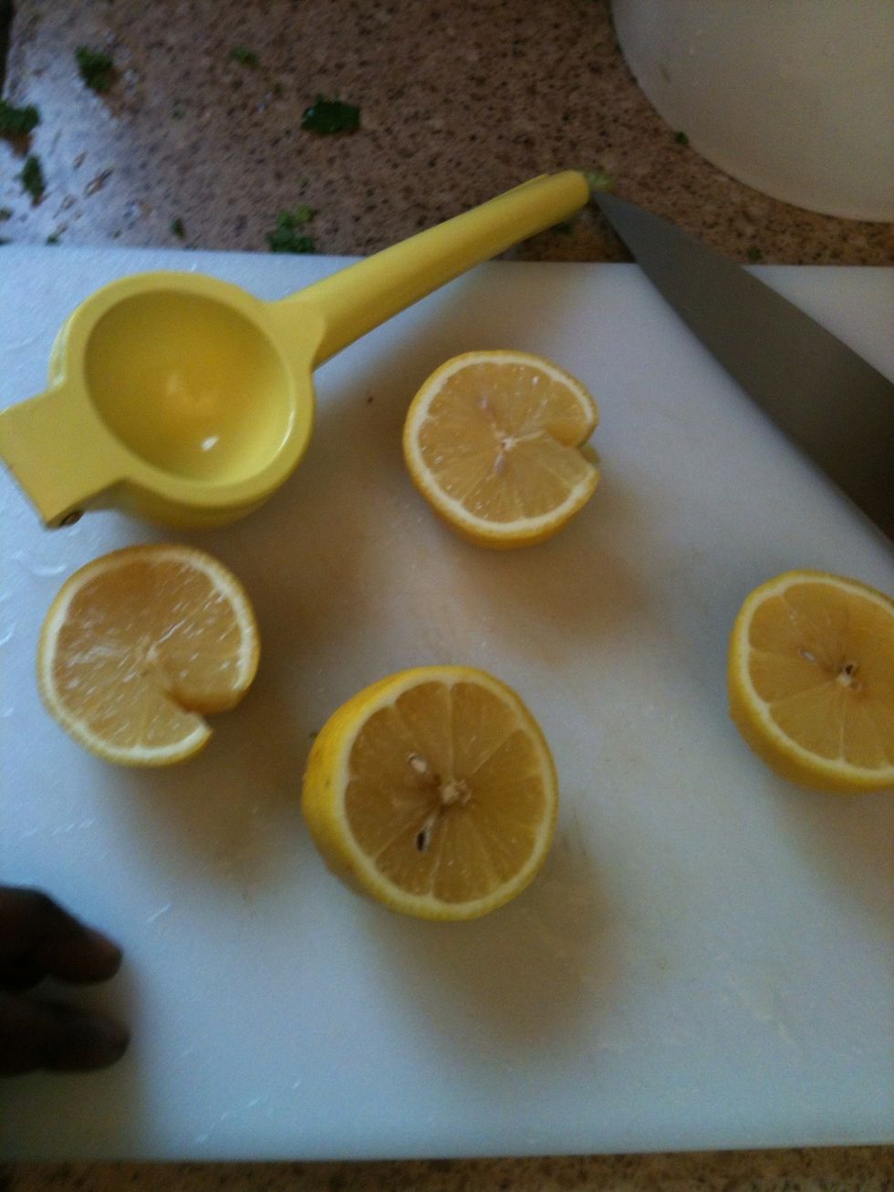 A great trick to get juice out of a lemon is soak it in hot water when it's whole. Squeeze the juice out of both lemons into a bowl and set aside for later.