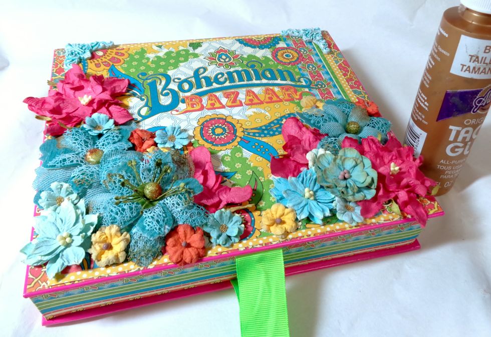 A heavy craft glue was used to adhere my flowers and corners.