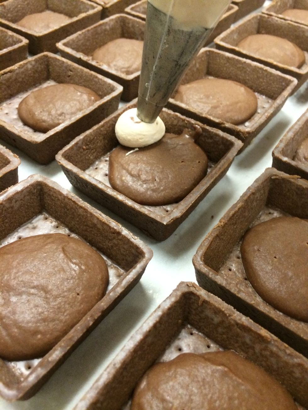 A large pastry bag fitted with a an open tip was used to fill all the tart shells.