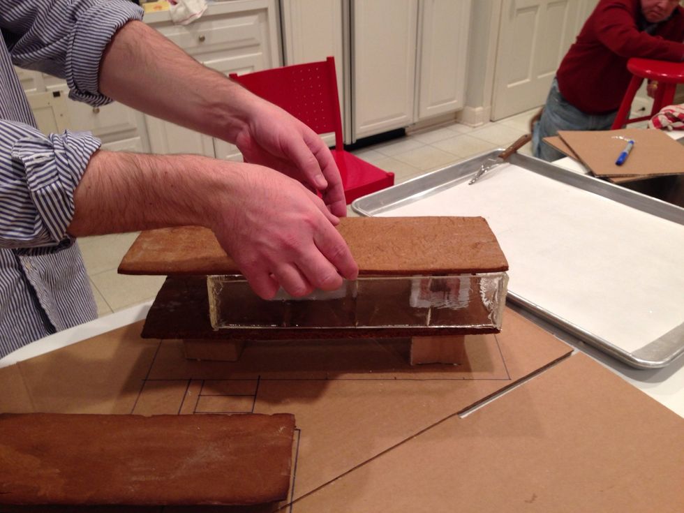 A little more glue on the top of the glass and Throckmorton can put on the roof.