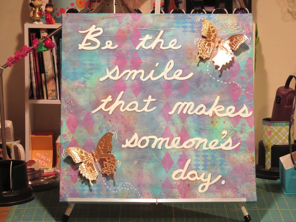 A little movement for the butterflies was added with white acrylic paint.