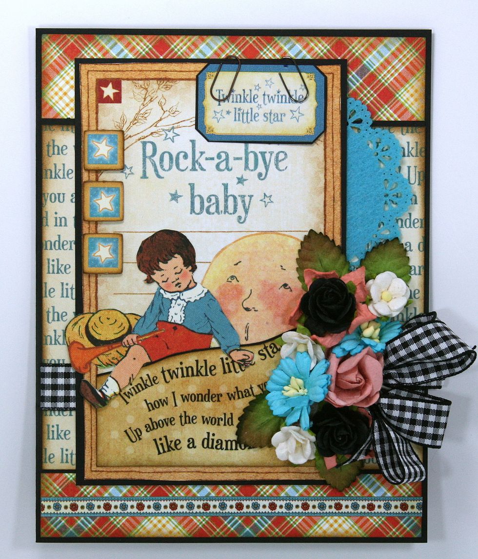 A lovely arraignment of dimensional flowers and a poofy ribbon bow. I've added 3 fun chipboard star elements to the edge of the journal card.