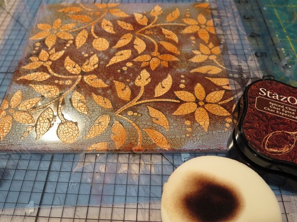 A makeup sponge was used to add ink to the board through this lovely floral Americana stencil.  StazOn ink has a mild glossy look on top of the crackle.