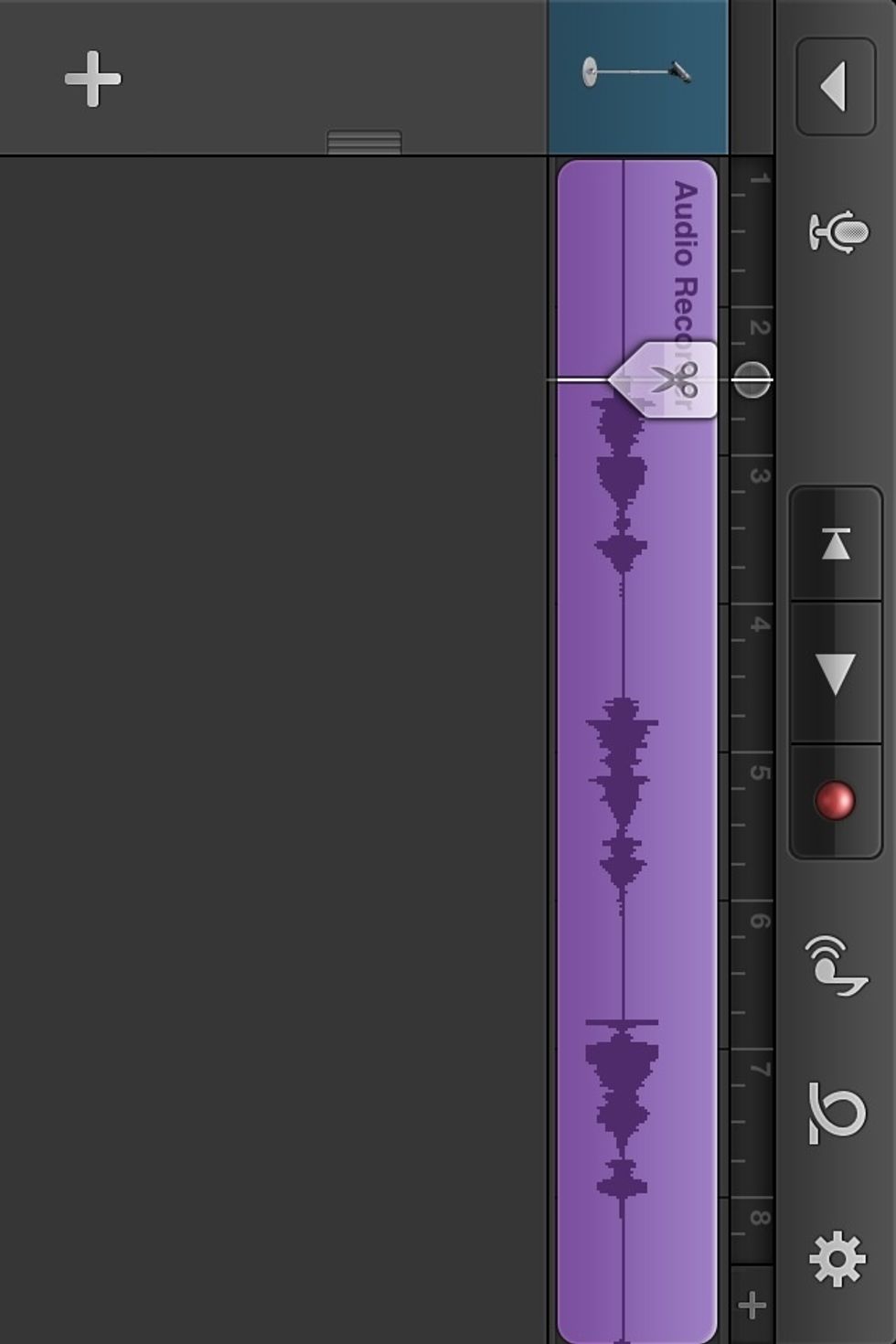 A menu will pop up (no picture). Select SPLIT from the menu. A scissors icon will pop up. Drag the scissors downward and it will split the audio.