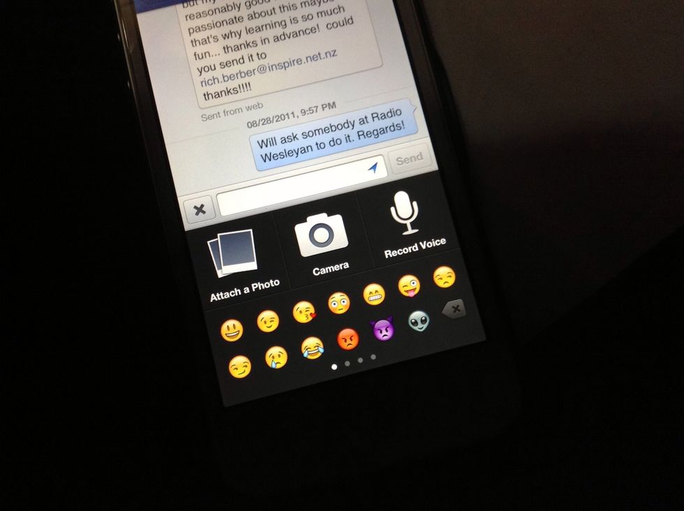 A menu will pop up with the options to attach photo, shoot a photo with the phone camera, make an audio recording or type emoji characters. Choose "Record Voice".