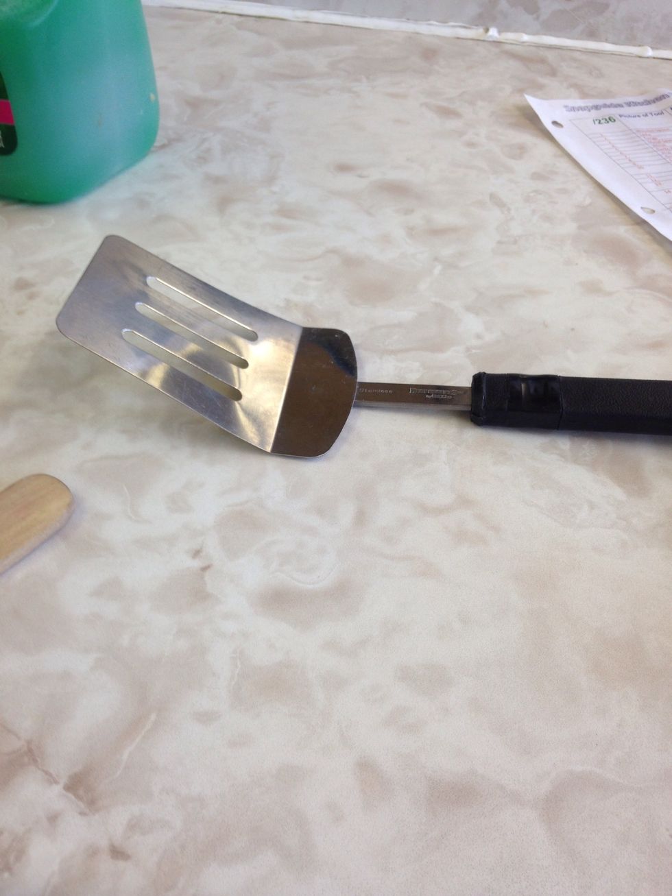 A metal spatula is used for flipping, lifting, or spreading. I can use this to flip pancakes.