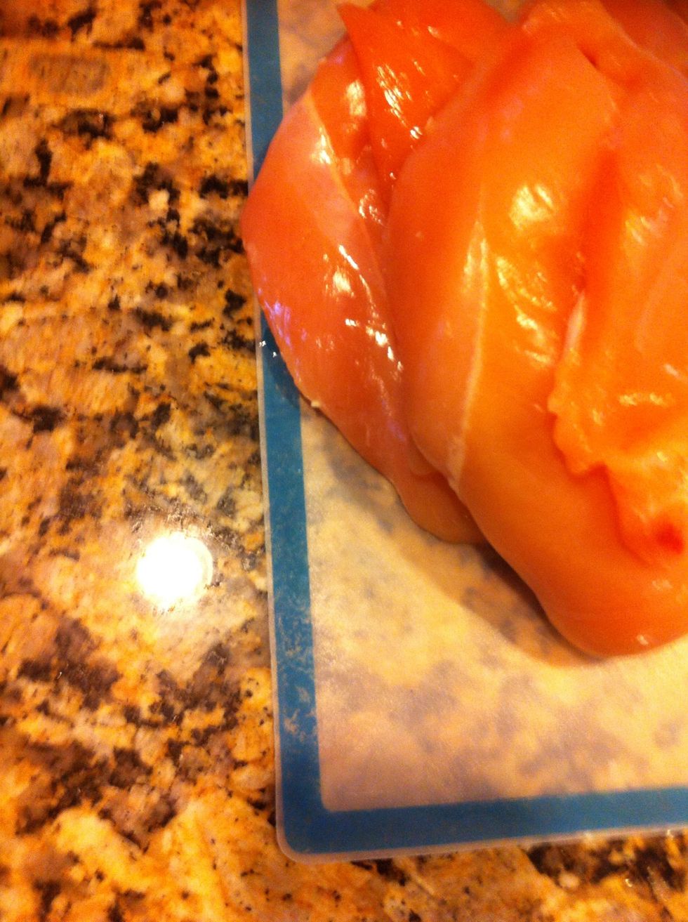 A package of chicken breasts, trimmed.