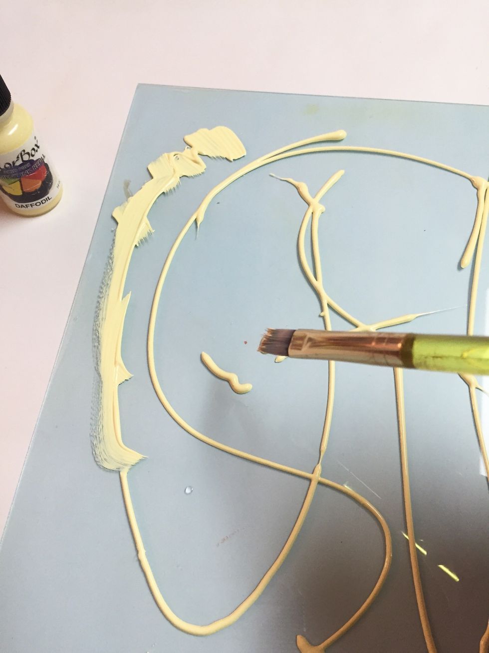 a paintbrush was used to spread ink.