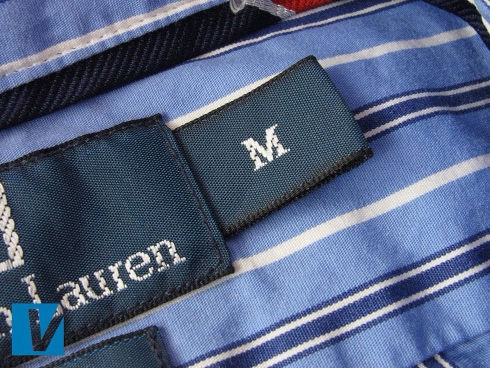 A Polo by Ralph Lauren shirt features a size label usually to the right side of the main collar label. Stitching will be evenly spaced and very neatly finished.