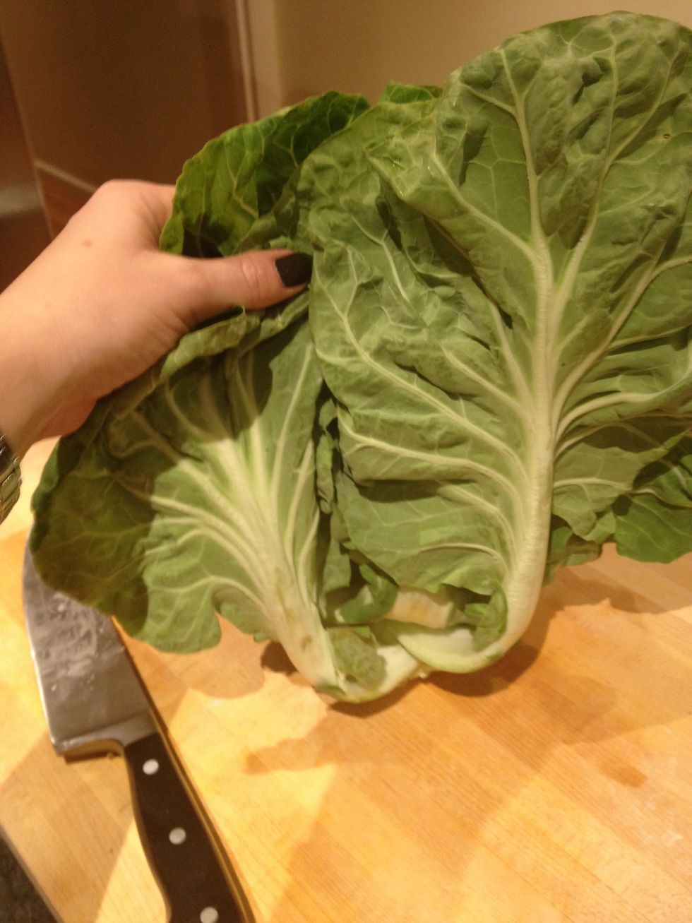A portuguese cabbage, such as the Couve Tronchuda shown here, is traditional in caldo verde. However almost any leafy green (kale, chard, etc) will work.