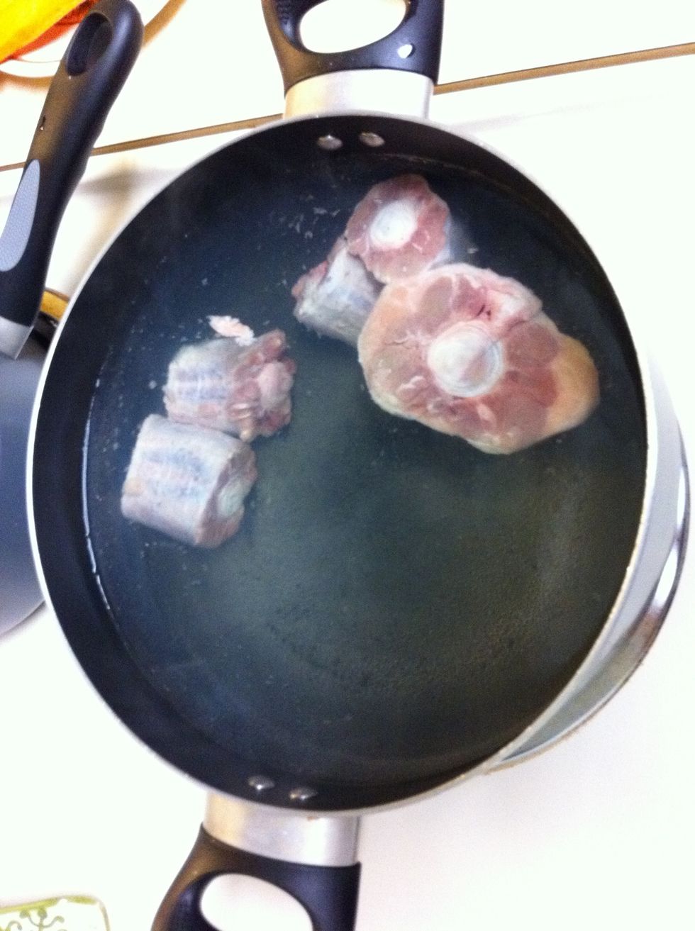 a pot with water, put on the stove and put the meat