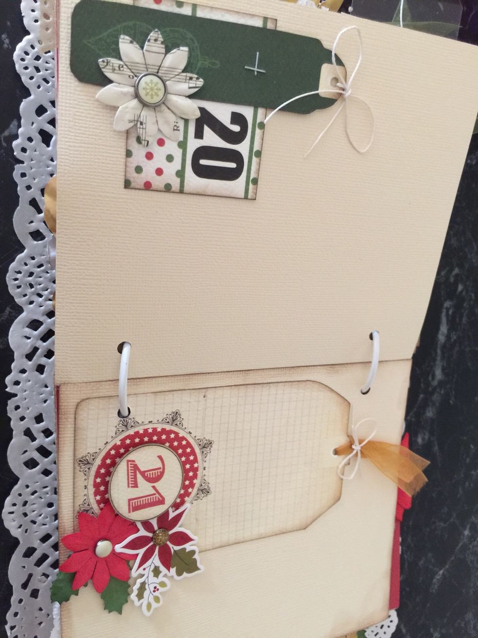 A pretty mix of fabric flowers and die cut flowers, add a brad or two....