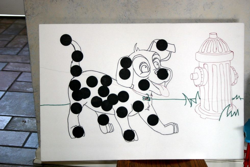 A puppy was drawn freehand on a poster board. Dots were hidden all over the room and each child was to find one and bring it back. After the dots were added the children listened to a story.