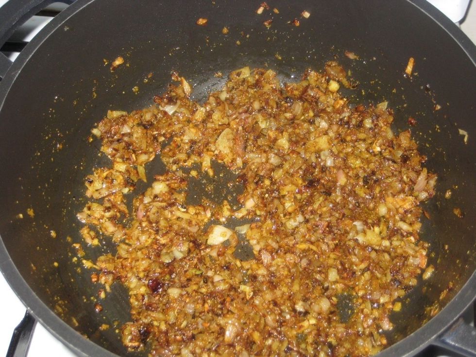 A quick stir will give a nice golden color. Allow the powders to cook with the onion and if you have to reduce the heat and cook for about 2-3 minutes