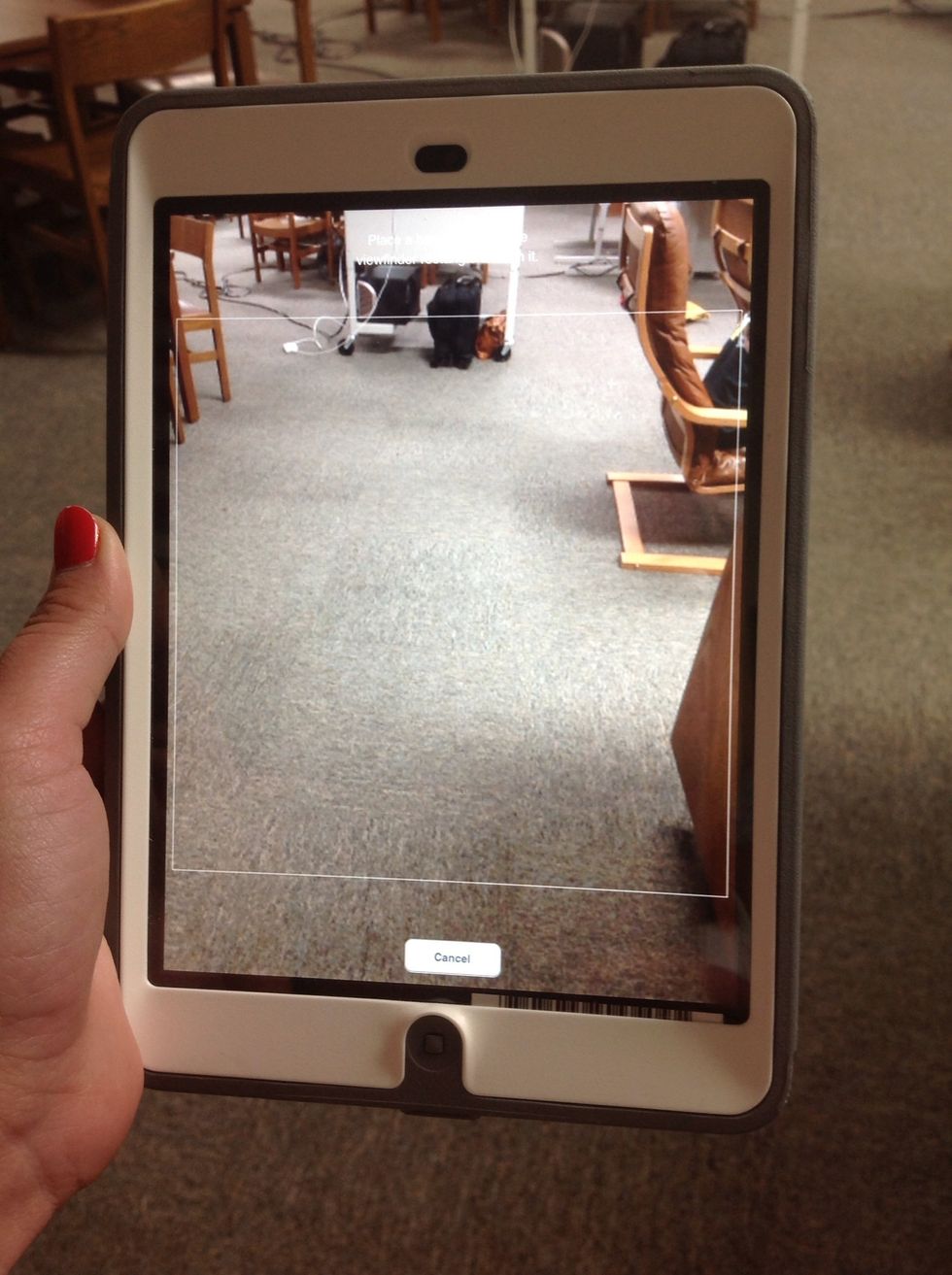 A screen will show up that looks like a camera. Go to the QR code that you want to scan and hold the screen over the QR code. This will take you to your special site!