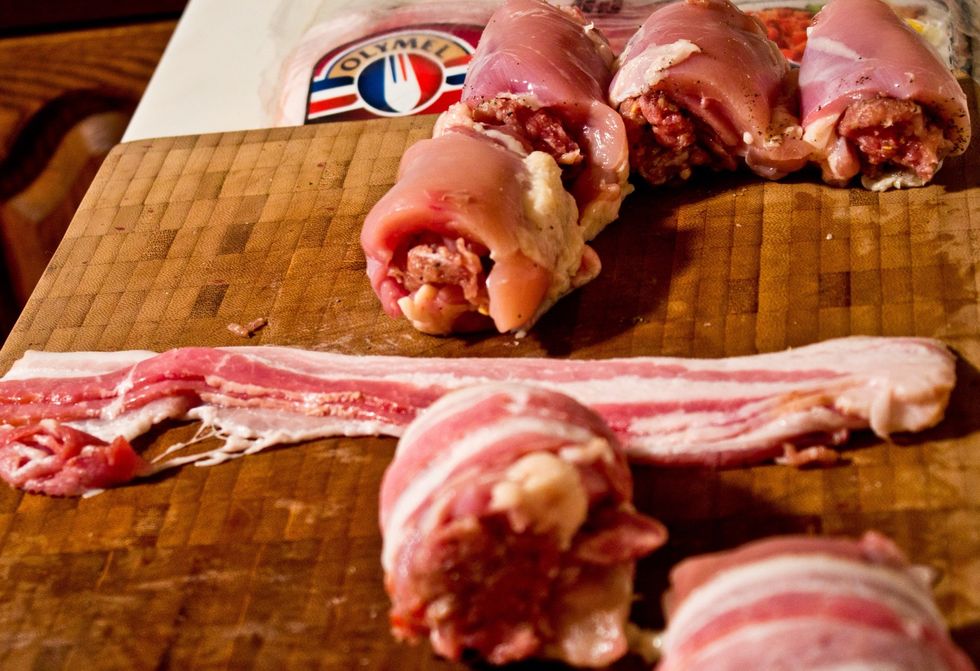 A single slice of bacon should be good for each one. I find stretching the bacon as I wrap helps to keep everything together during cooking