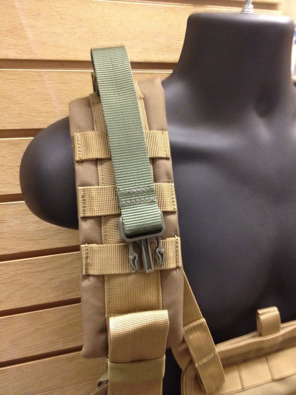 A sling that is integrated into your vest is one of the best ways to keep your gun attached to you without adding all sorts of extra bulk with a single or two point sling wrapped around you.