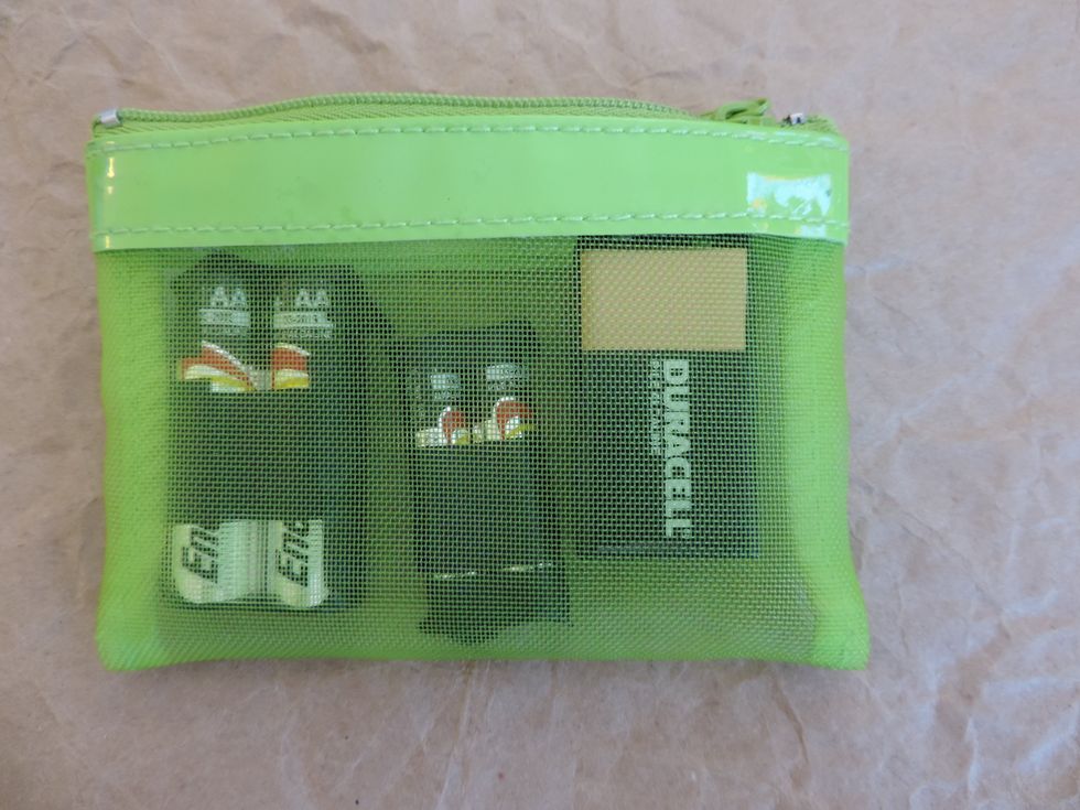 A small coin purse is great for keeping batteries organized.