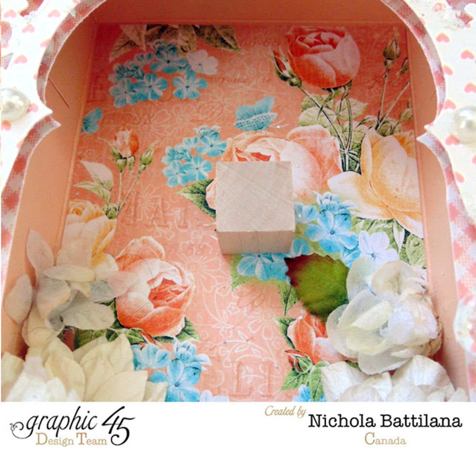 A small wooden block applied to the back of the box provides a sturdy base to affix your little fairy.