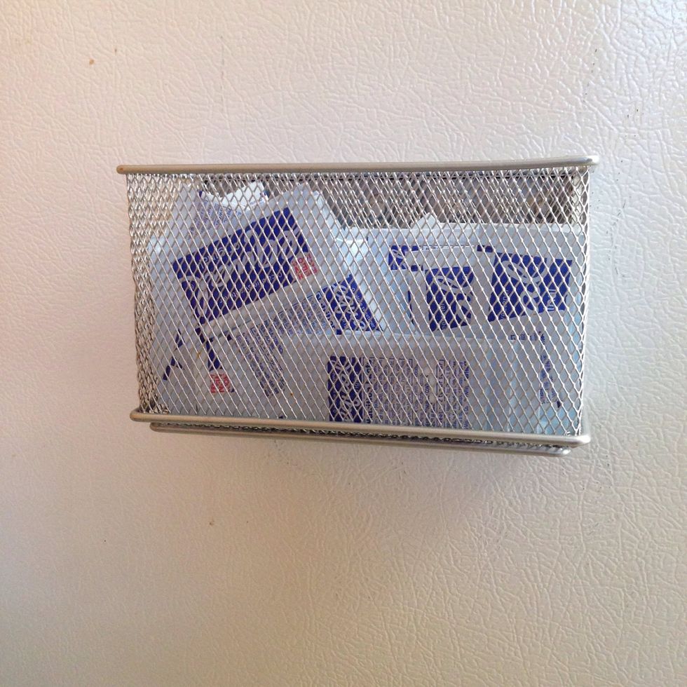 A stainless steel mesh magnetic organizer i have at the side of my refrigerator. I store my sugar satchels in it, comes in very handy every time you make your coffee