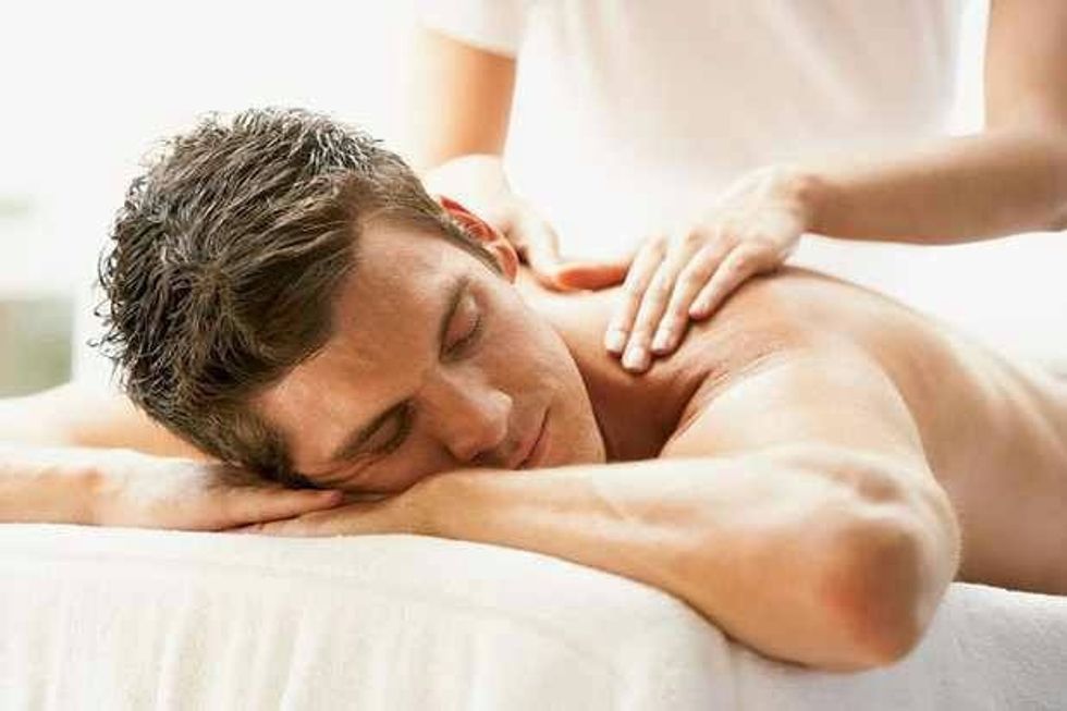 A very light massage could help loosen the "kinks" but be very careful. If you've ever had this kind of stiff neck you'll know the lightest touch in the wrong spot could be very painful.